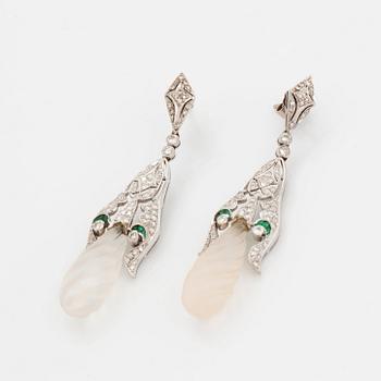 A pair of 18K white gold earrings with rock crystal drops.