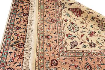 An oriental silk carpet, a. 280 x 185 cm.