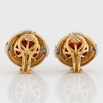 A pair of 18K gold and white gold earrings set with coral.