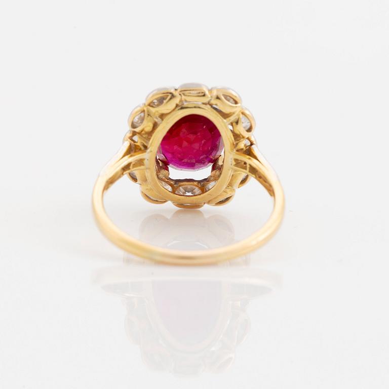 An 18K gold and platinum ring set with a faceted ruby weight ca 3.35 cts.