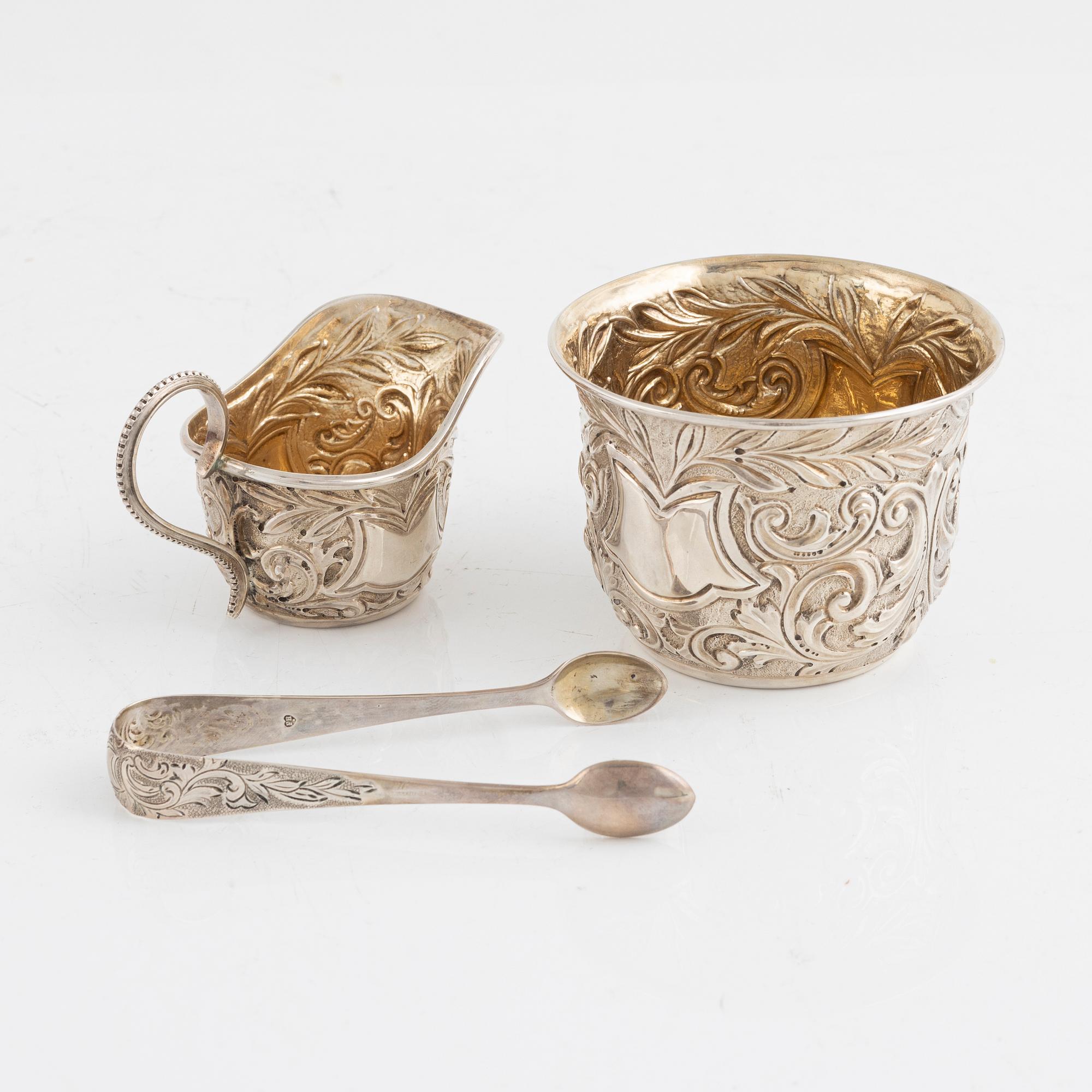 A silver sugar bowl with thongs and a creamer, in original box, Mappin & Webb, London, England, 1900-1901.