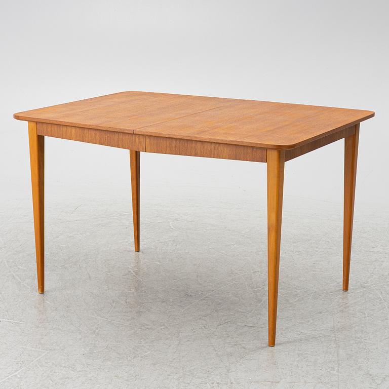 A mid20th century dining table.