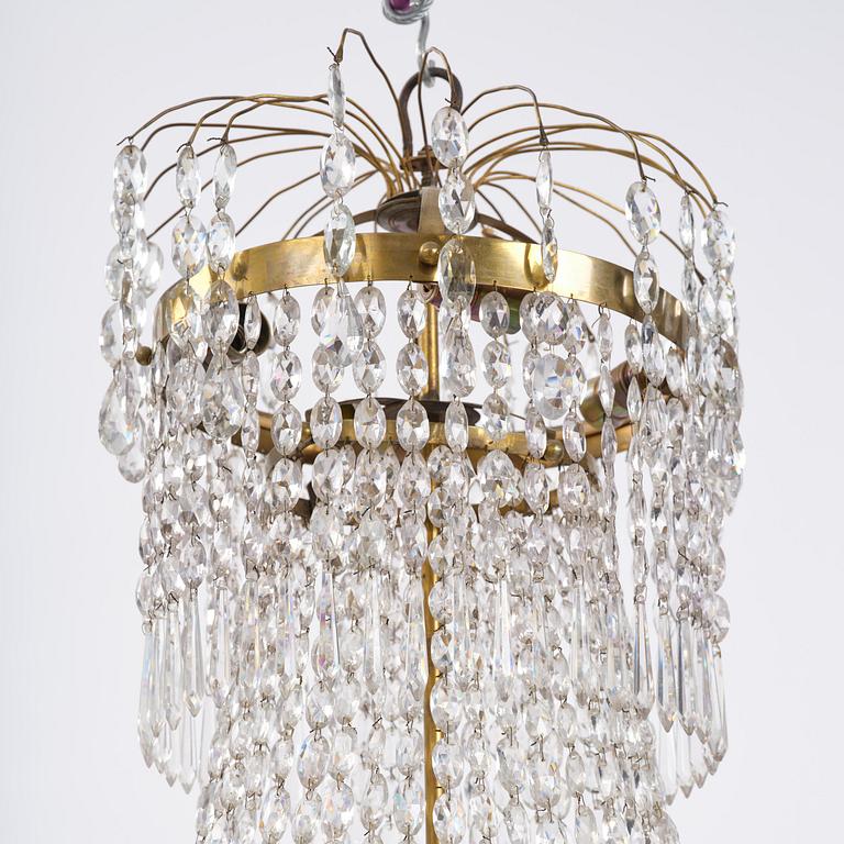 A Swedish late Empire gilt brass nine-light chandelier, 1830's.