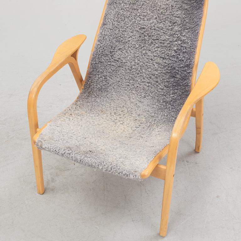 Yngve Ekström, a 'Lamino' armchair with a foot stool, Swedese.