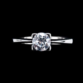 415. A RING, brilliant cut diamond c. 0.85 ct and small diamonds c. 0.30 ct in total.