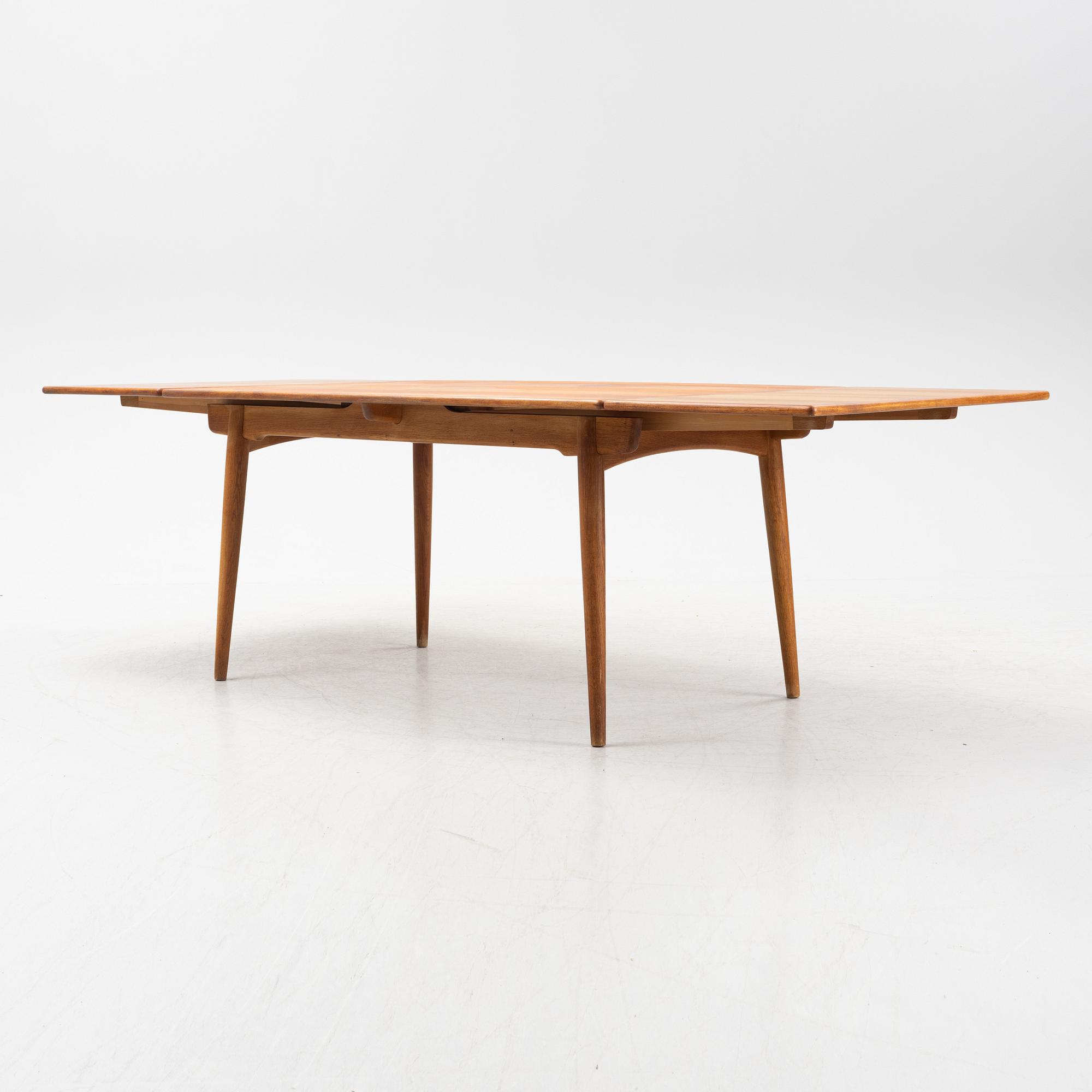 Hans J Wegner, a model 'AT-312' teak veneered dining table, Andreas Tuck, Denmark.