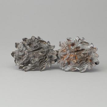 A pair of cast iron candlesticks, marked Verlag bei, A. Meves, Berlin, late 20th century.