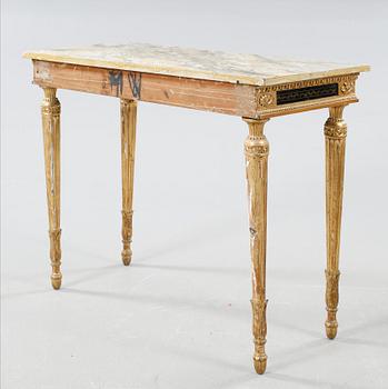 A late Gustavian table , around the year 1800.