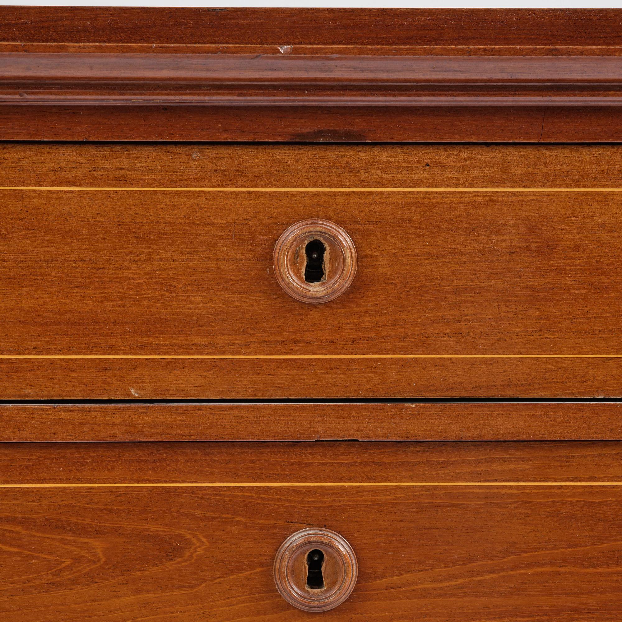 A late Gustavian mahogany writing commode in the manner of I. Löfgren, Stockholm circa 1800.