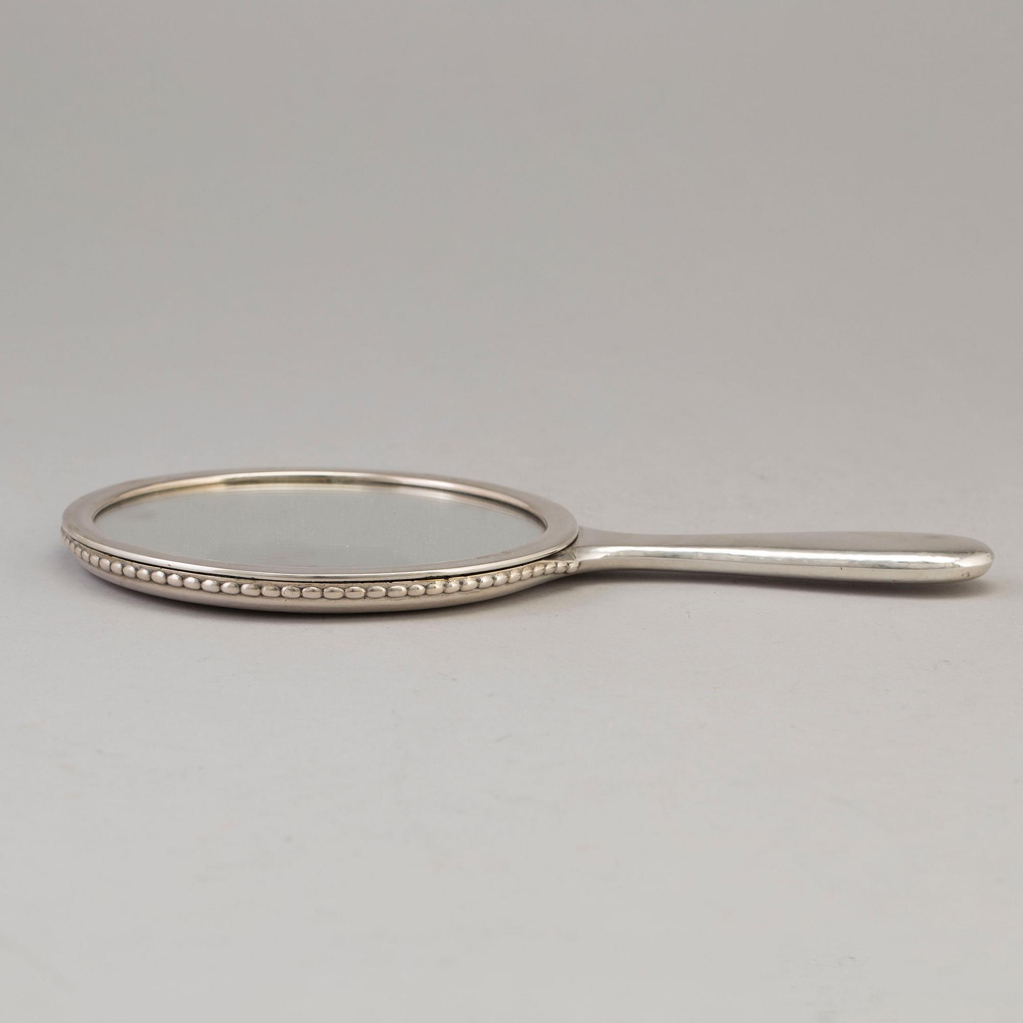 A Swedish silver hand mirror, maker's mark K. Anderson, Stockholm 1919.