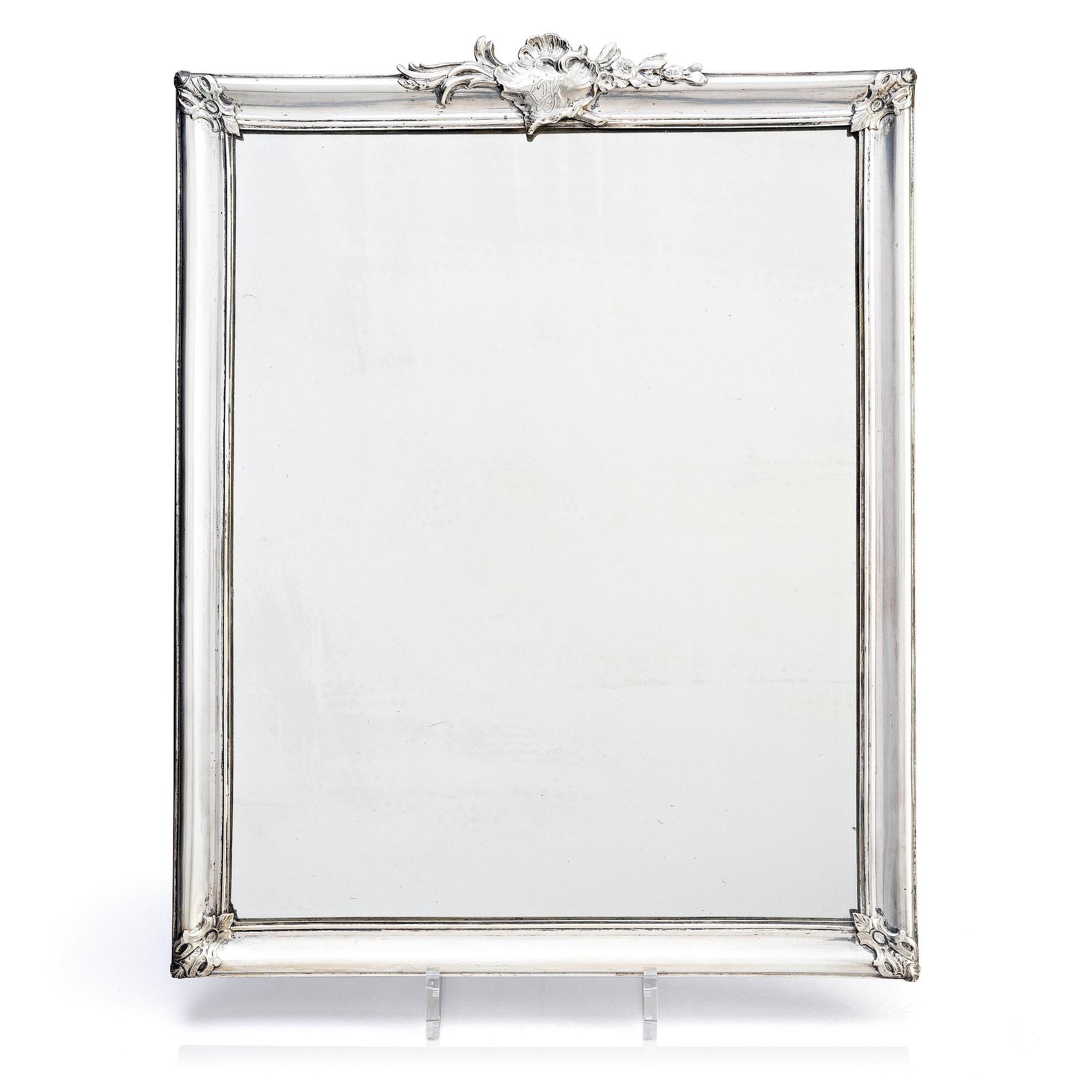 A Swedish Rococo mid-18th century mirror with silver frame  signed by Christian Precht.