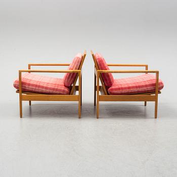 ERIK WØRTS, a pair of oak 'Kastrup' easy chairs from IKEA, designed in 1961.