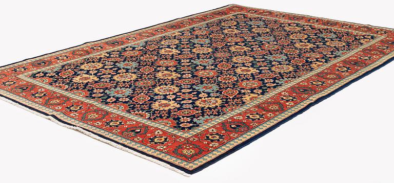 A Tabriz carpet of Harshang design, c. 353 x 250 cm.