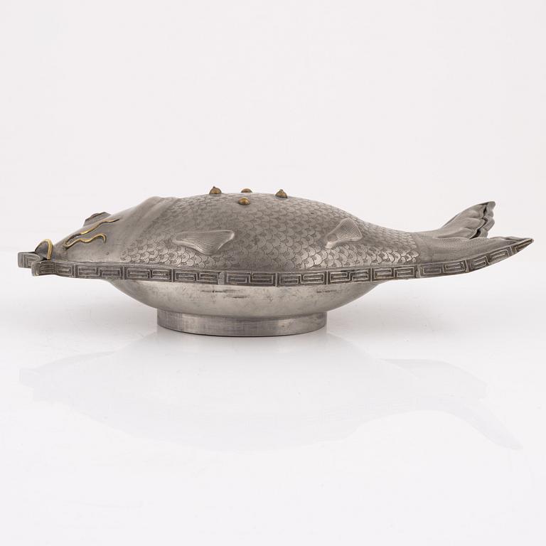 A pewter jelly mould with lid.