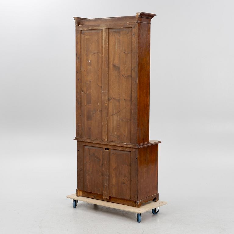 A 19th century walnut veneered  book cabinet.