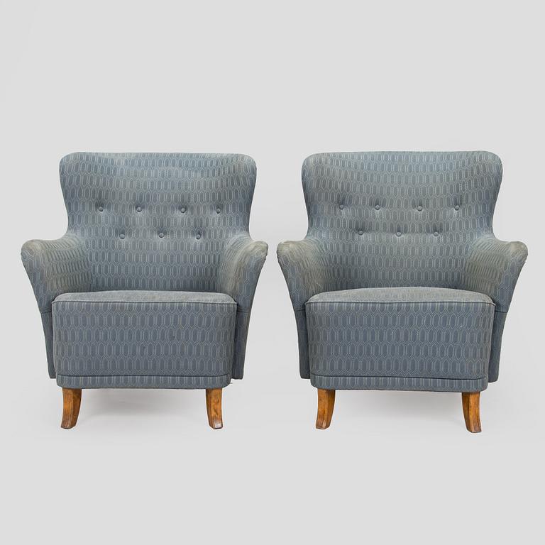 A pair of mid-20th century armchairs.