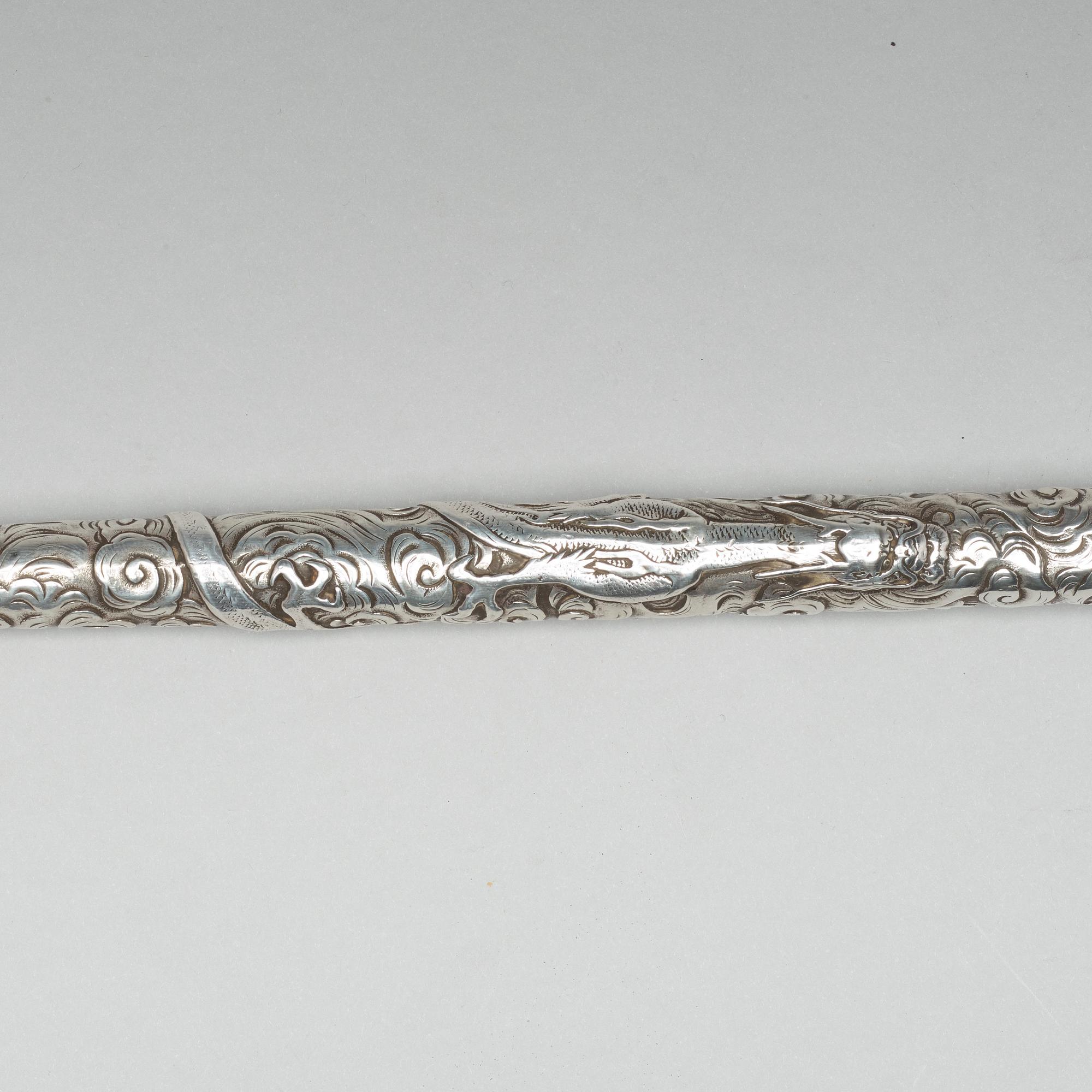 A Japanese silver opium pipe, Meiji period (1868-1912).