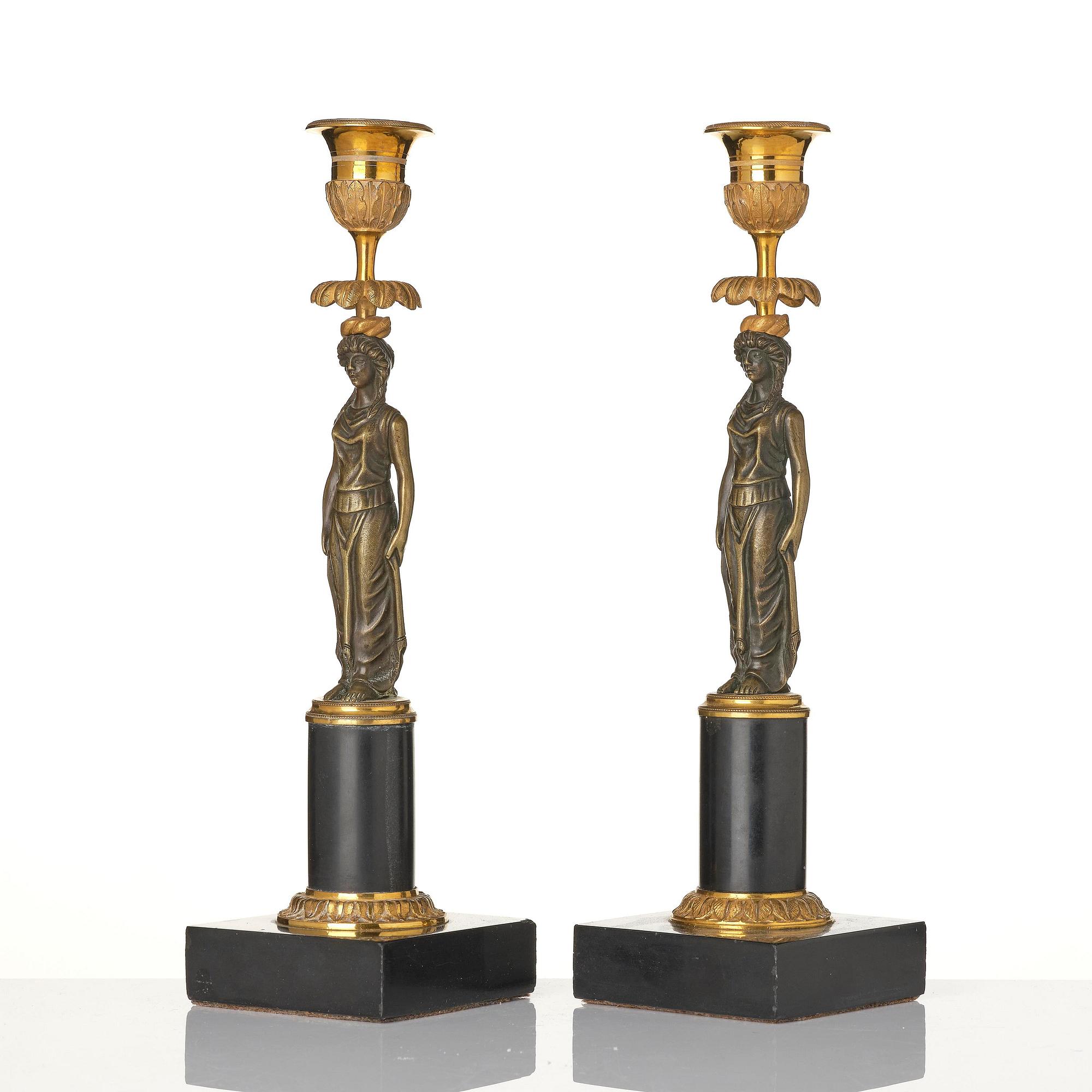 A pair of late Gustavian marble and ormolu candlesticks in the manner of F. L. Rung (1758-1837).