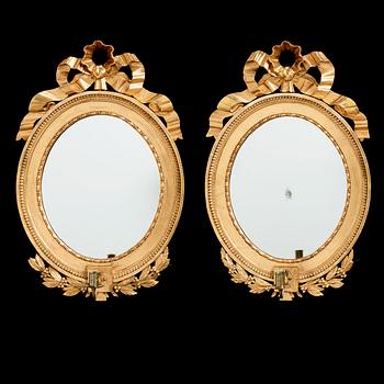 76. A pair of late Gustavian early 19th century one-light girandol mirrors.