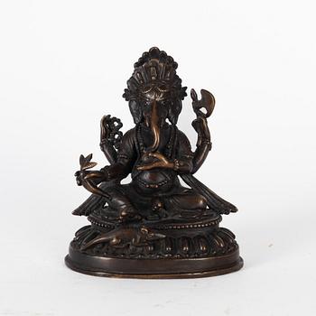 A Nepalese bronze deity, 20th century.