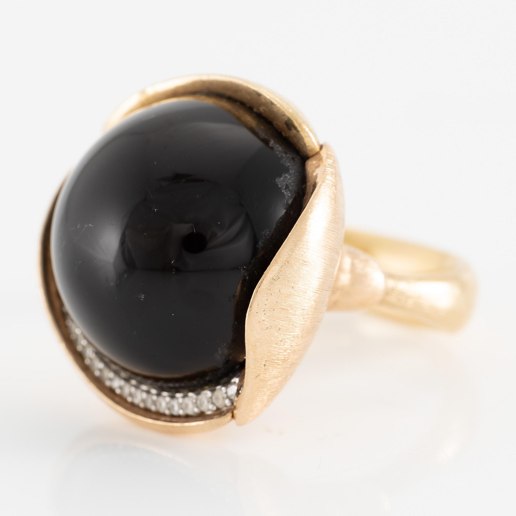 Ole Lynggaard, ring, large Lotus, 18K gold with cabochon-cut black stone probably onyx with brilliant-cut diamonds.