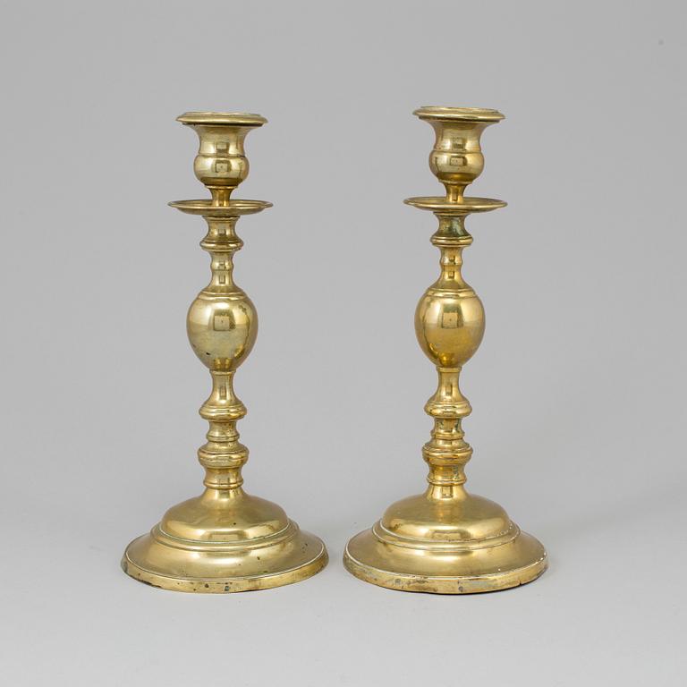 A PAIR OF BRONZE CANDLESTICKS, early 19th century.