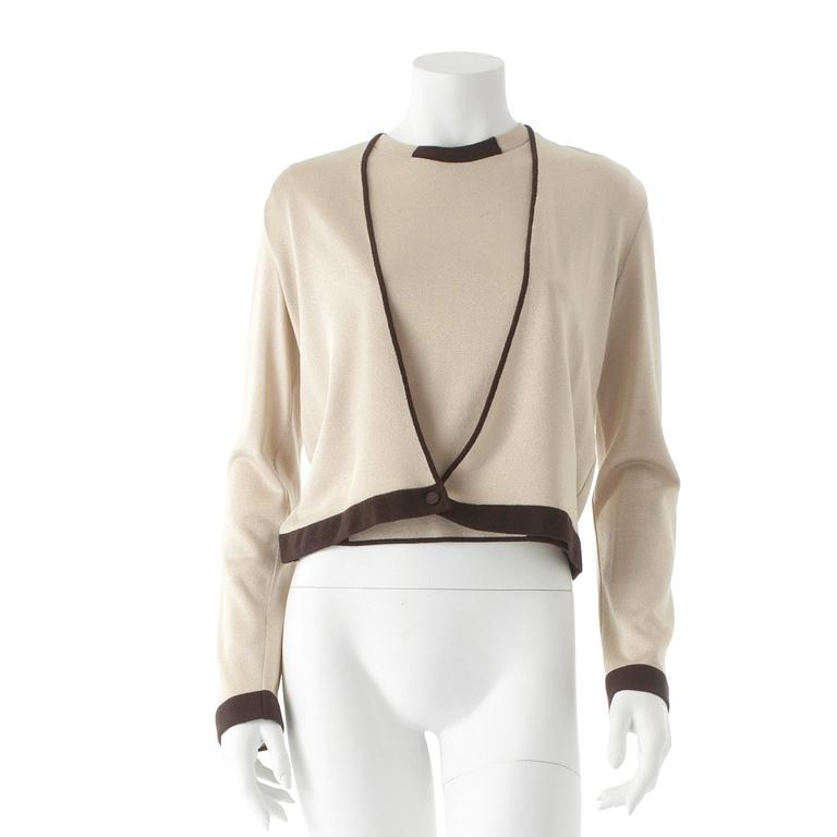 CHANEL, a gold colored and brown sweater set consisting of a sleevles top and cardigan.