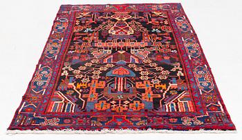 An oriental rug, ca 233 x 128 cm.