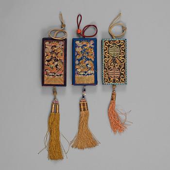 A set of eleven embroidered silk, gold and silver thread small cases, late Qing dynasty (1644-1912)/Republic (1912-1949).