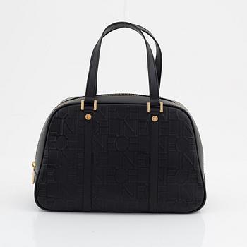 Céline, a black, embossed leather handbag.