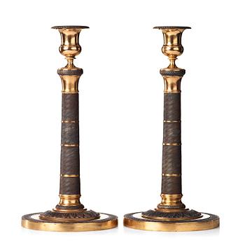 88. A pair of French Empire early 19th century candlesticks.