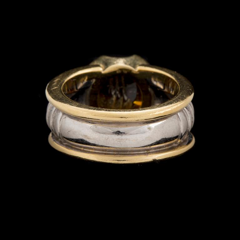 An 'On track' ring by Jan Jörgensen for Georg Jensen set with a fantasy cut citrine, ca 1980's.