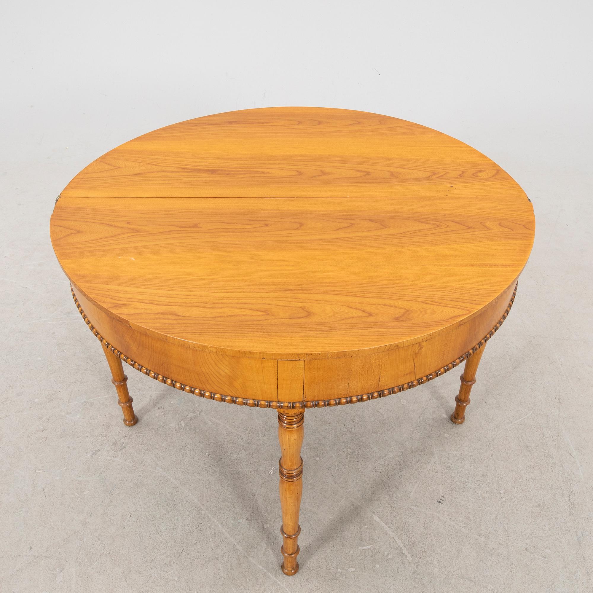 A kid 1800s late Empire birch game table.