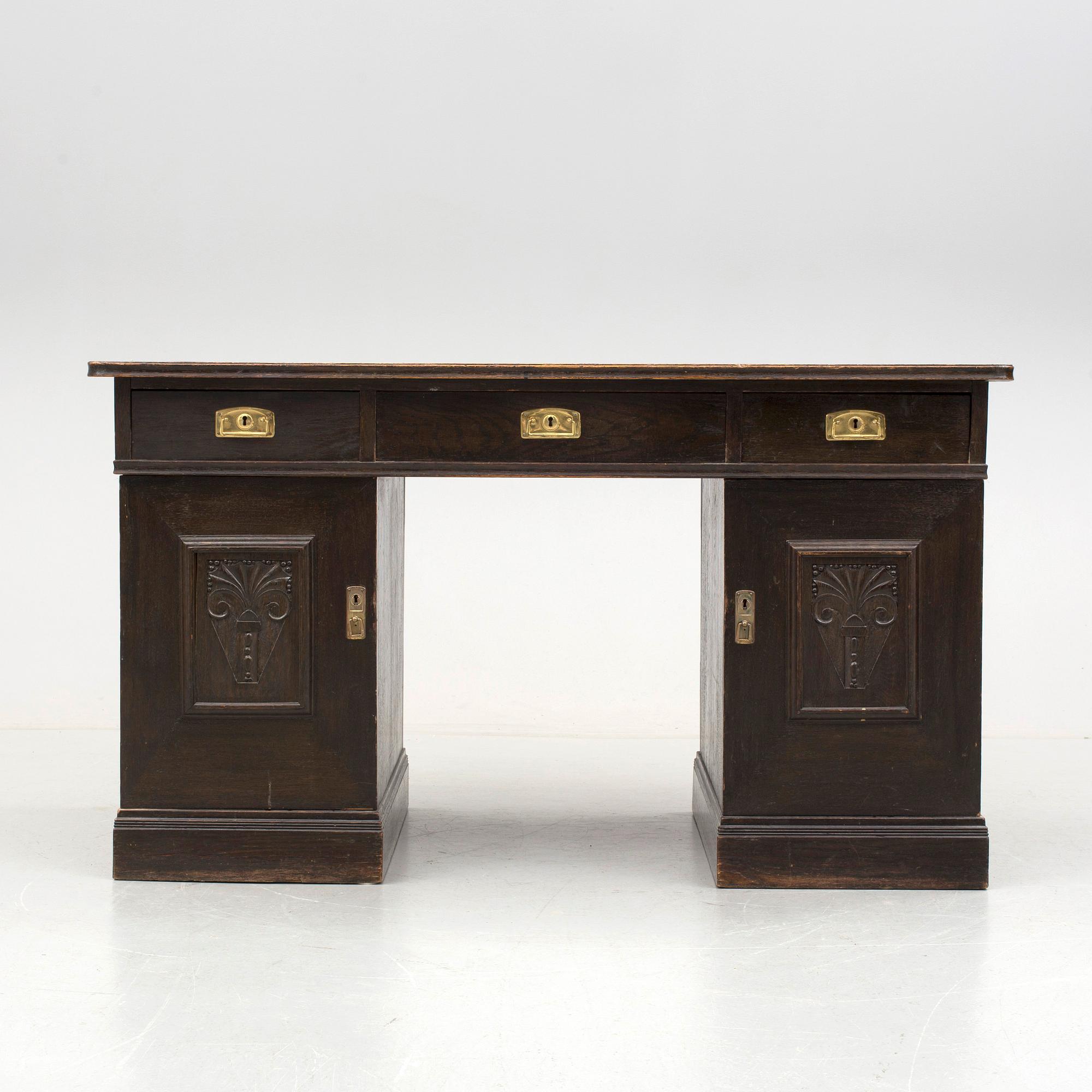 An early 1900s oak writing desk.