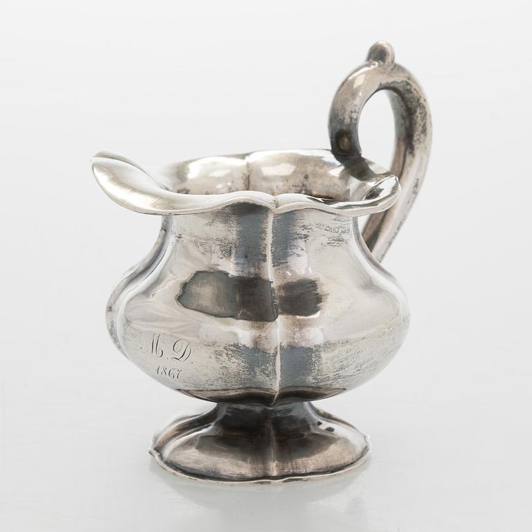 A silver cream jug, maker's mark of Michael Takkinen, St. Petersburg 1856.
