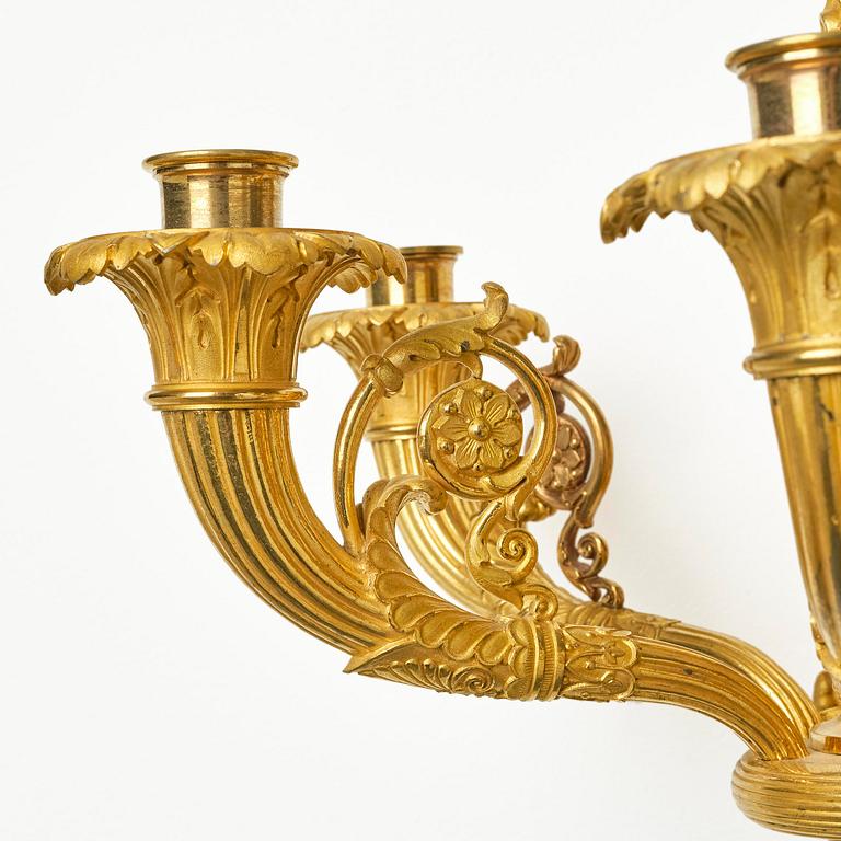 A pair of French Empire six-branch ormolu appliques, ca 1820's.