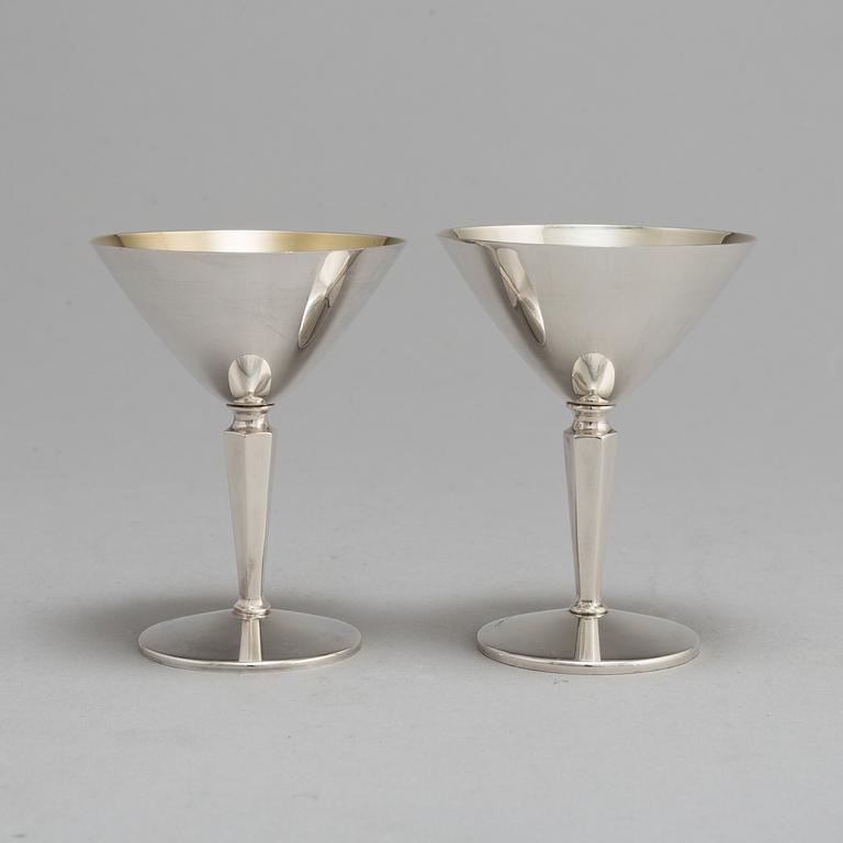 A SET OF 14 SILVER COCKTAILGLASSES, 1960s.