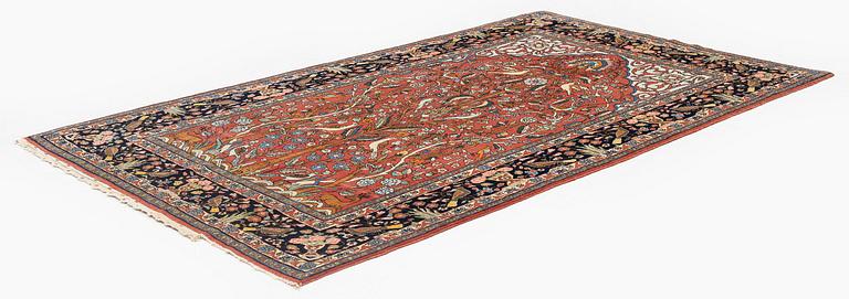 An antique 'Manchester' Kashan rug, central Persia, c 222 x 133 cm.