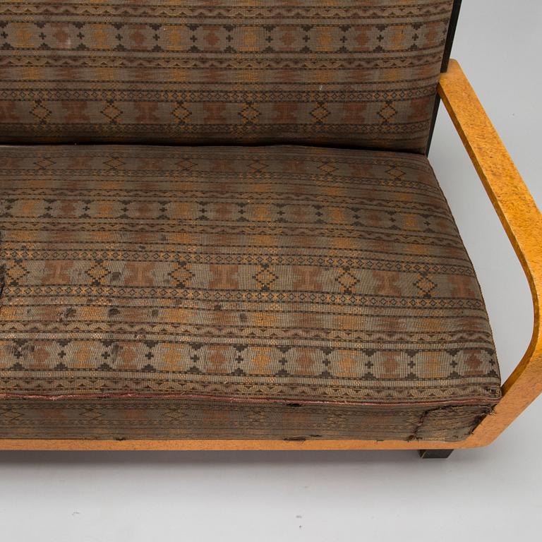 A  1920s Carelian birch veneered sofa.