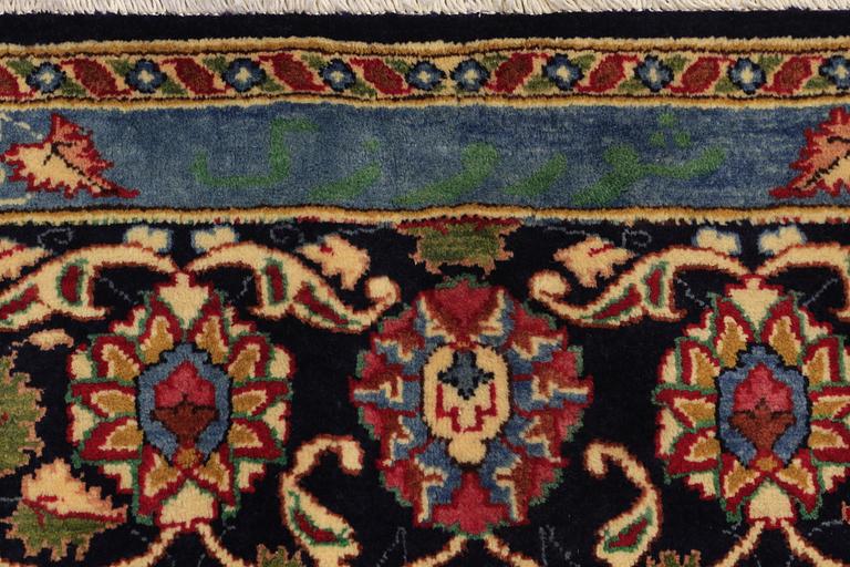 A carpet, Kashmar, signed, ca 390 x 295 cm.