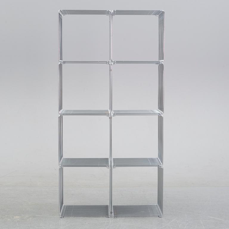 A 'Panton wire' shelving system by Verner Panton for Montana.