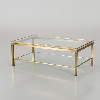 A BRASS GLASS TOP COFFEE TABLE.