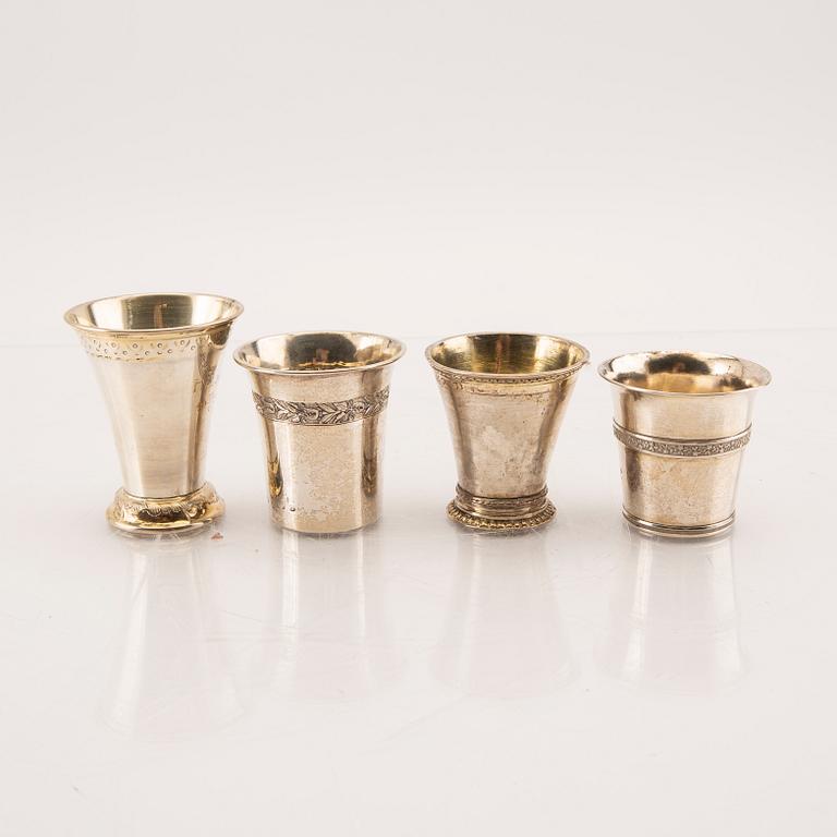 A set of four 19th/20th century silver beakers weight 207 grams.