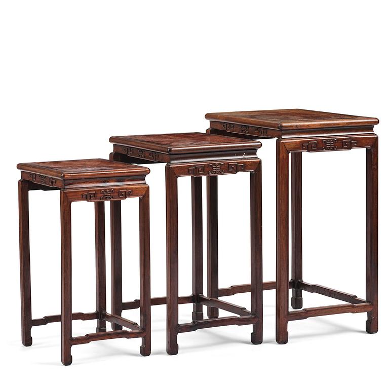 A Chinese hardwood three piece nesting table, early 20th century.