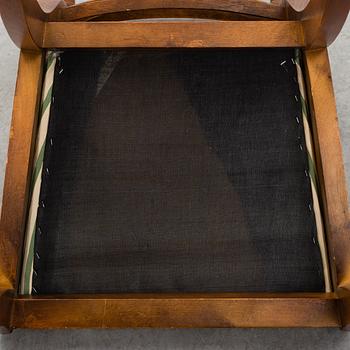 A late 20th century English style dining table and six chairs.
