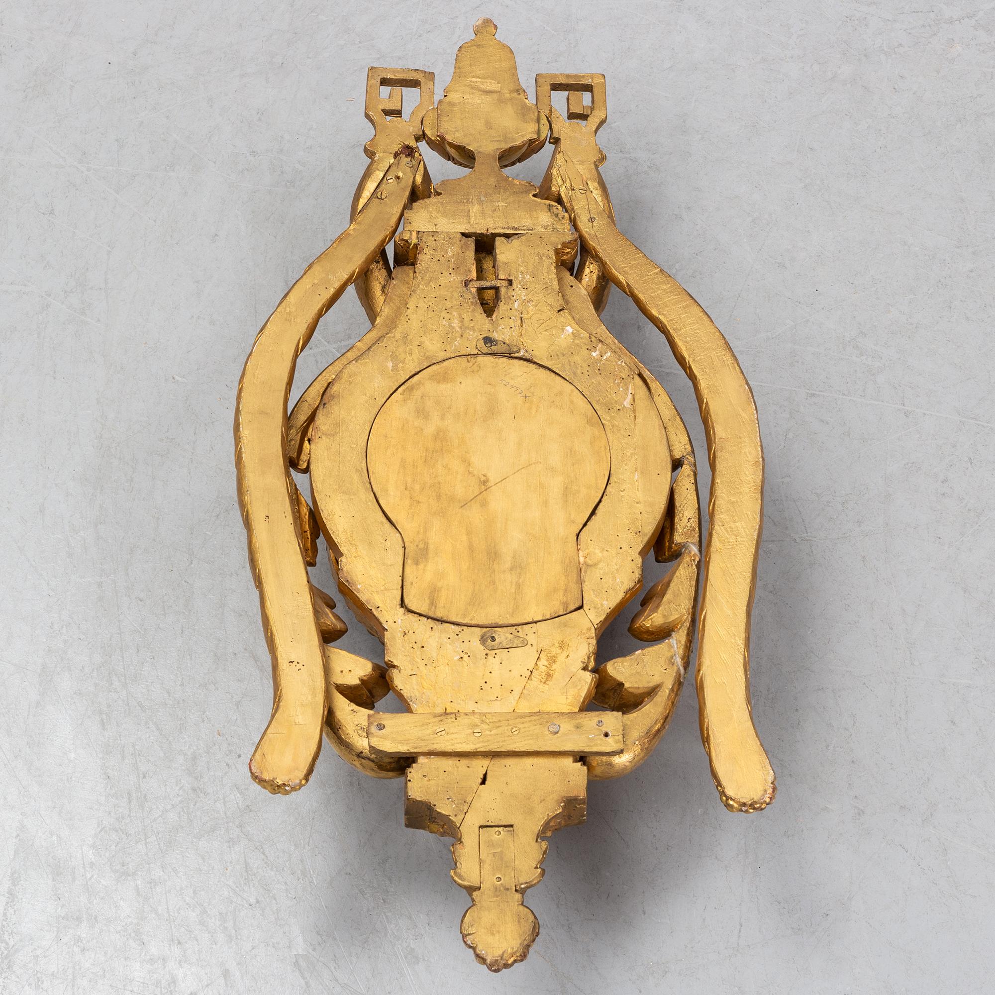 An 18th century Louis XV wall clock Jean-Petit L´Aine, Amsterdam.