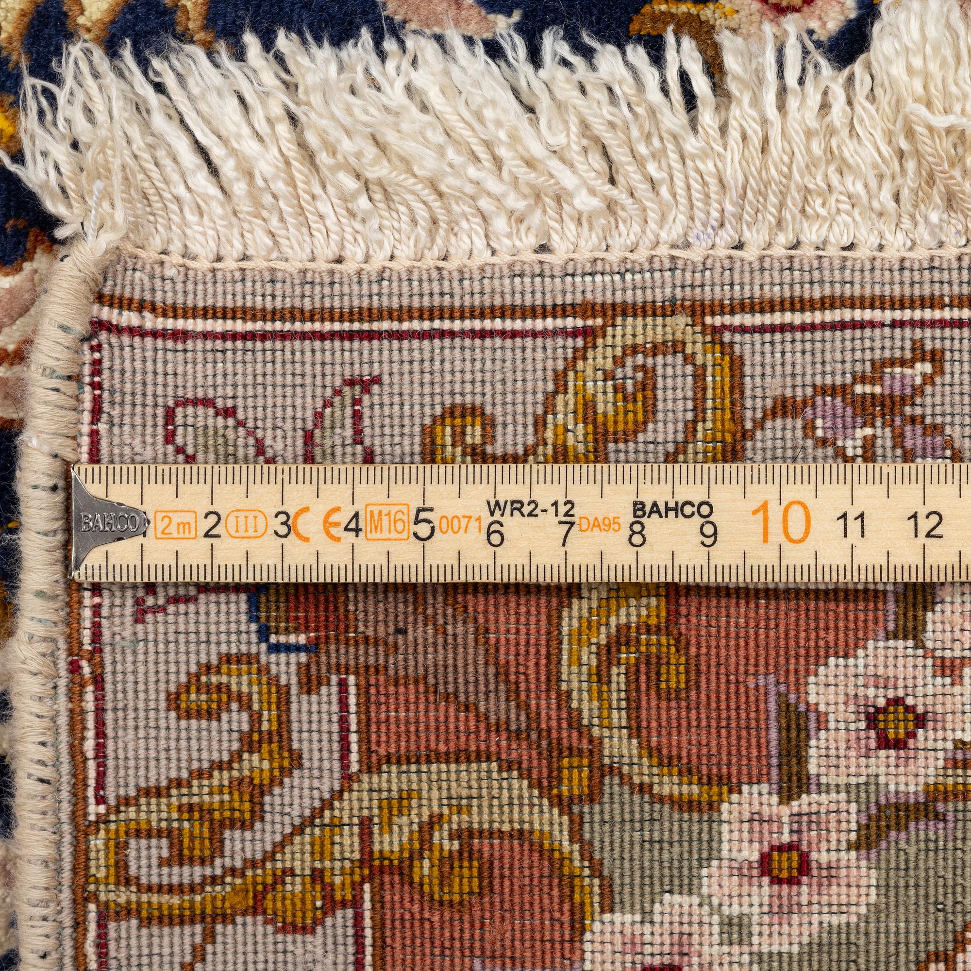 A Tabriz carpet, part silk, c. 206 x 147 cm.