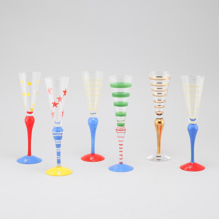 Nine late 20th century champagne glasses and decanter, "Clown", for Orrefors.