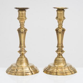 A pair of 18th century brass, argent haché candlesticks, Régence, France.