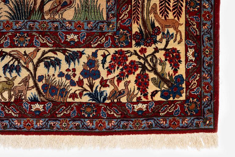 A semi-antique Qum carpet, Central Persia, c. 312 x 215 cm.